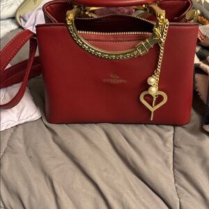 Luxurious Red Satchel with Gold Accents